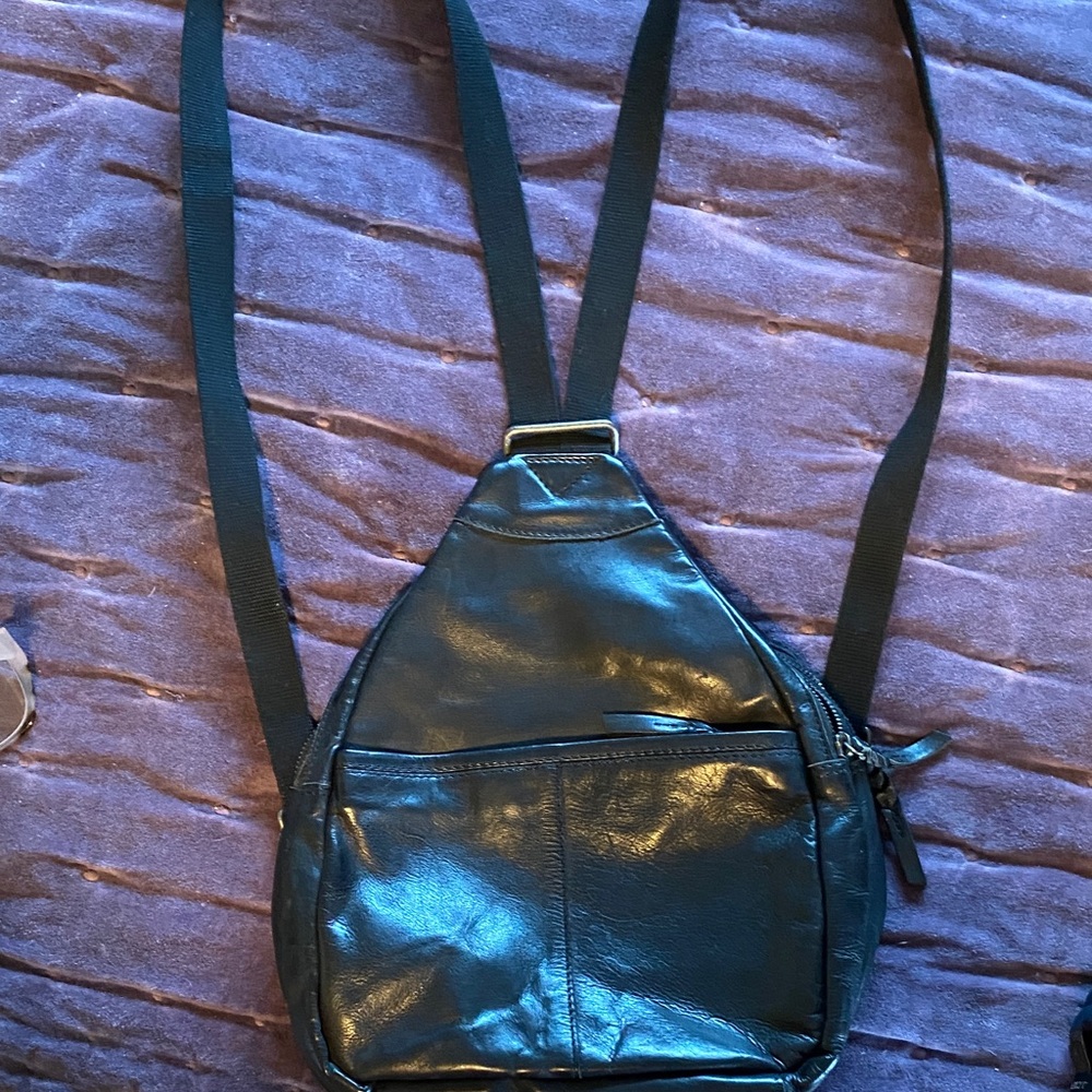Black Leather Sling Bag . Backpack. Like new